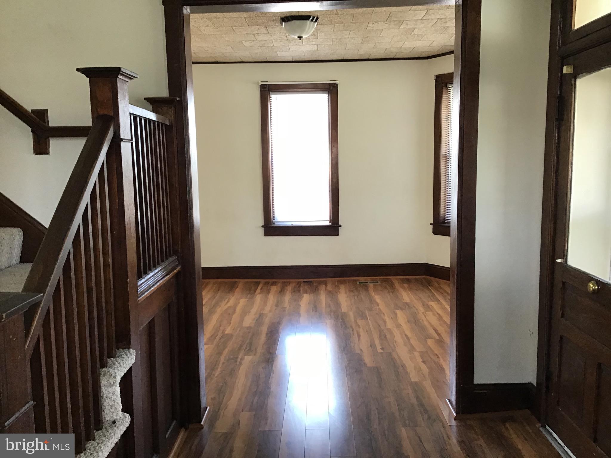 1822 East Main Street Waynesboro, PA 17268 - Photo 18 of 21 a view of an empty room with wooden floor and a window