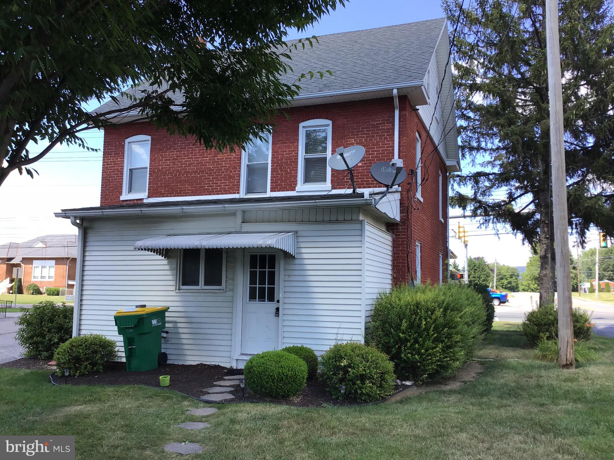 1822 East Main Street Waynesboro, PA 17268 - Photo 2 of 21 a view of a house with a yard plants and large tree