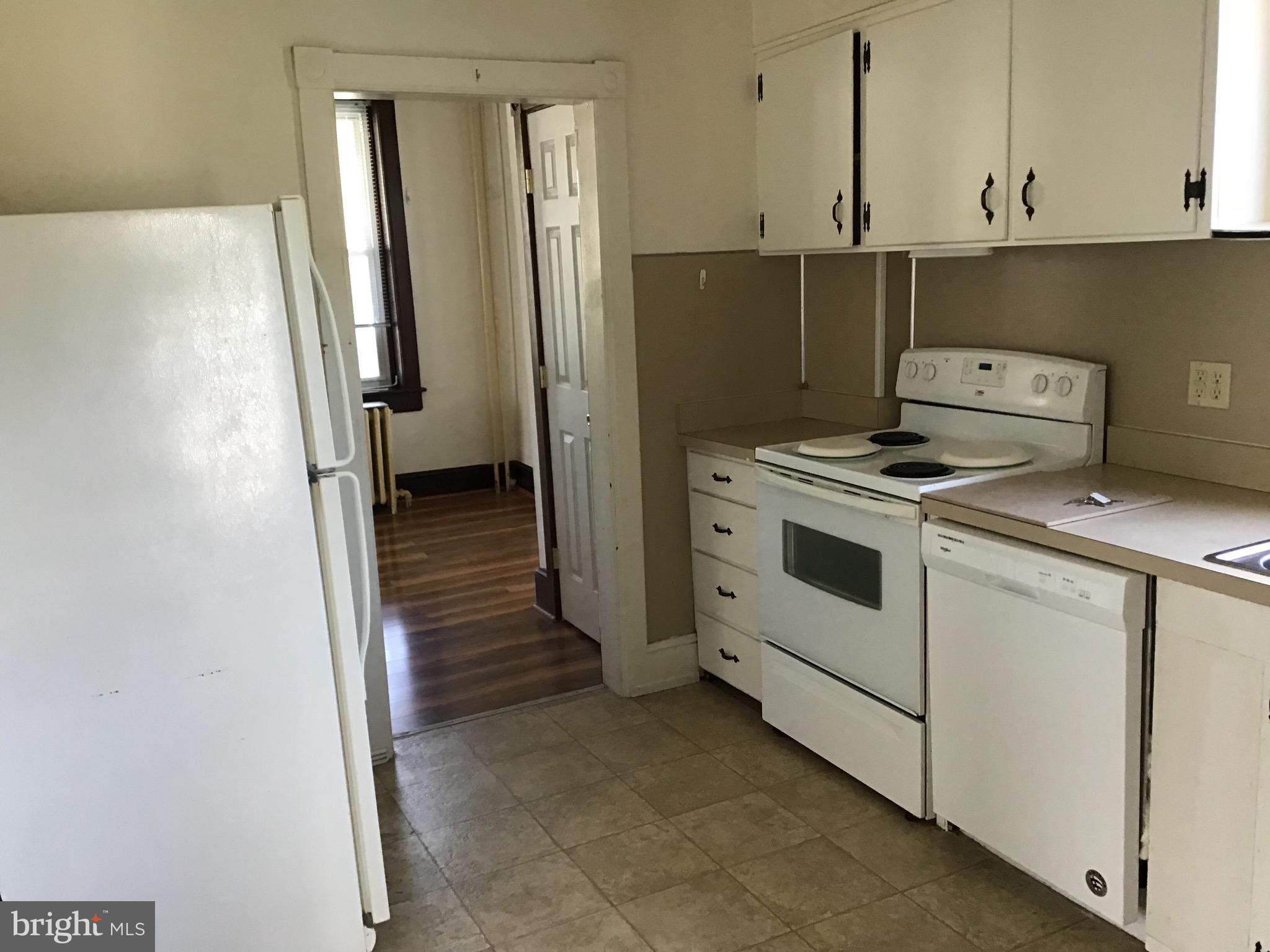 1822 East Main Street Waynesboro, PA 17268 - Photo 3 of 21 a kitchen with a stove microwave and refrigerator