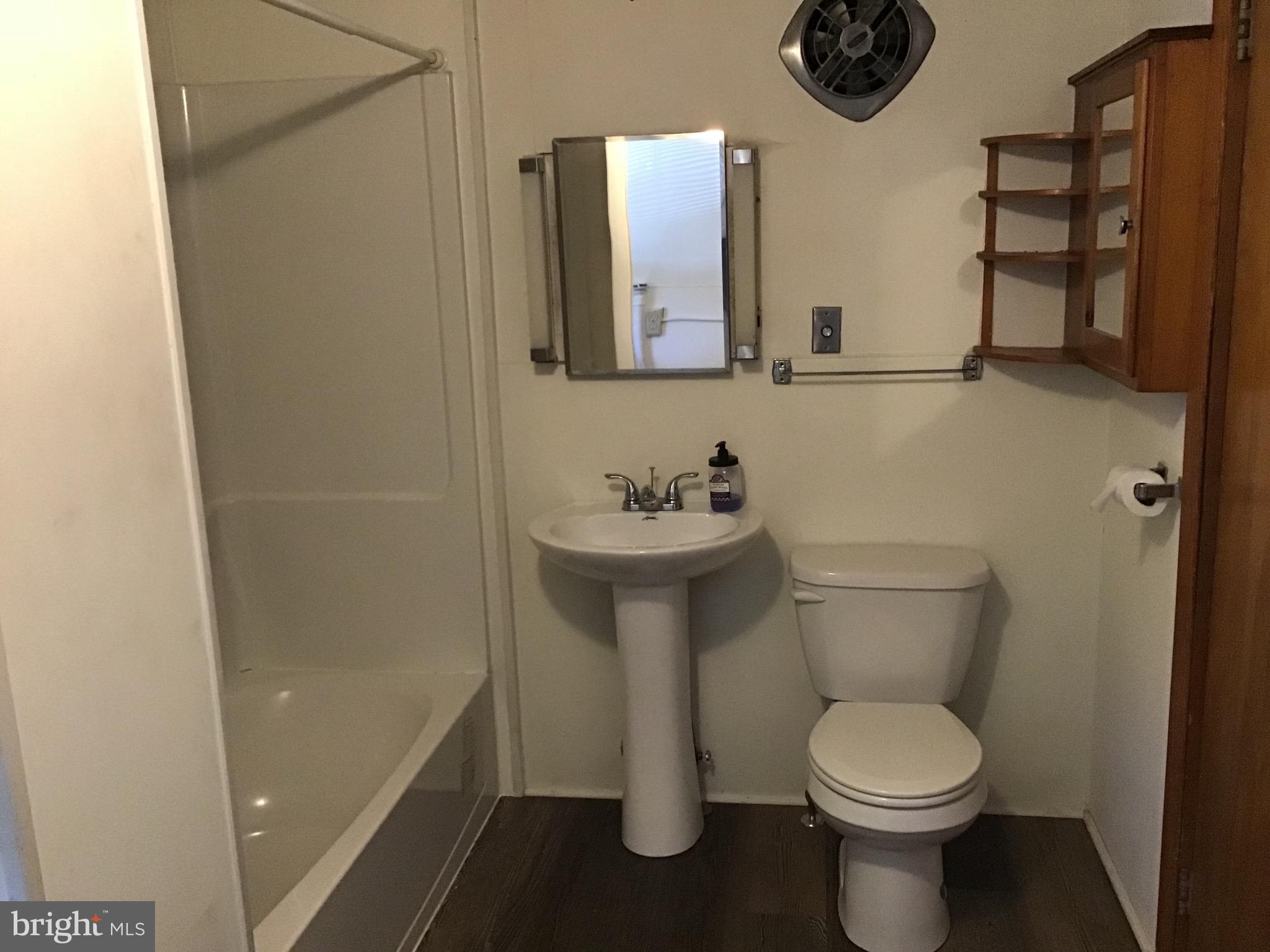 1822 East Main Street Waynesboro, PA 17268 - Photo 8 of 21 a bathroom with a toilet sink and mirror