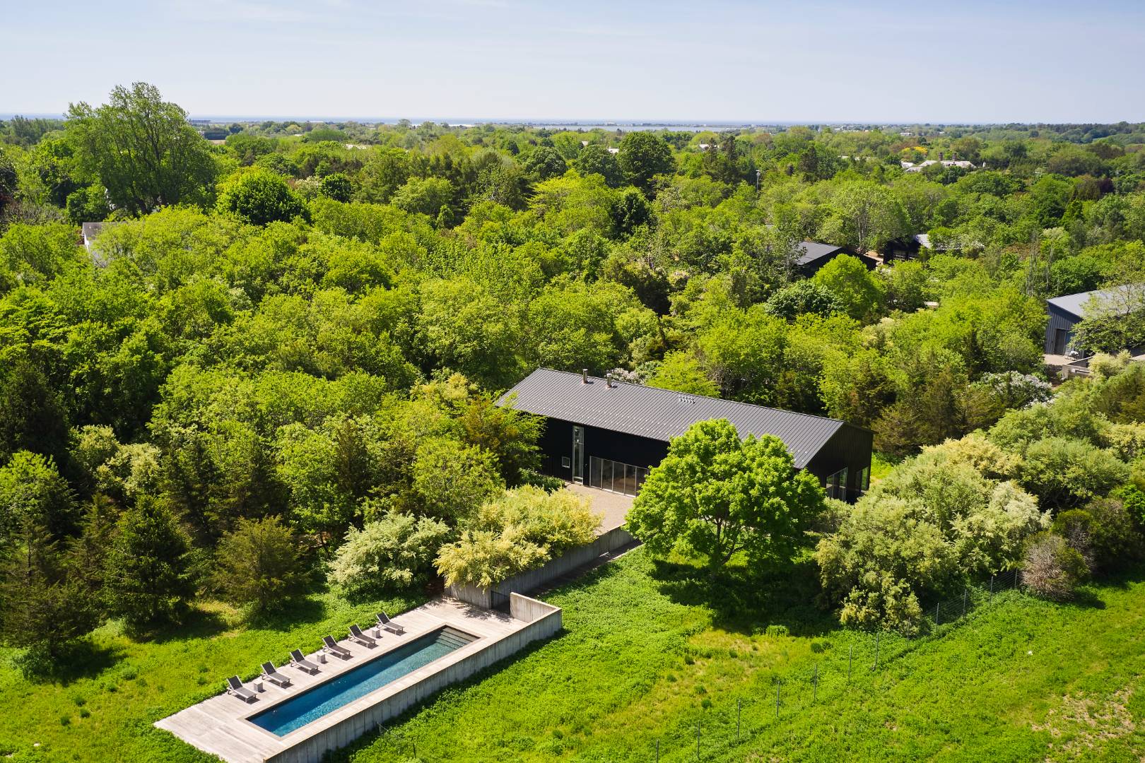 78 Windmill Lane Water Mill, NY 11976 - Photo 1 of 26 an aerial view of a house with a yard