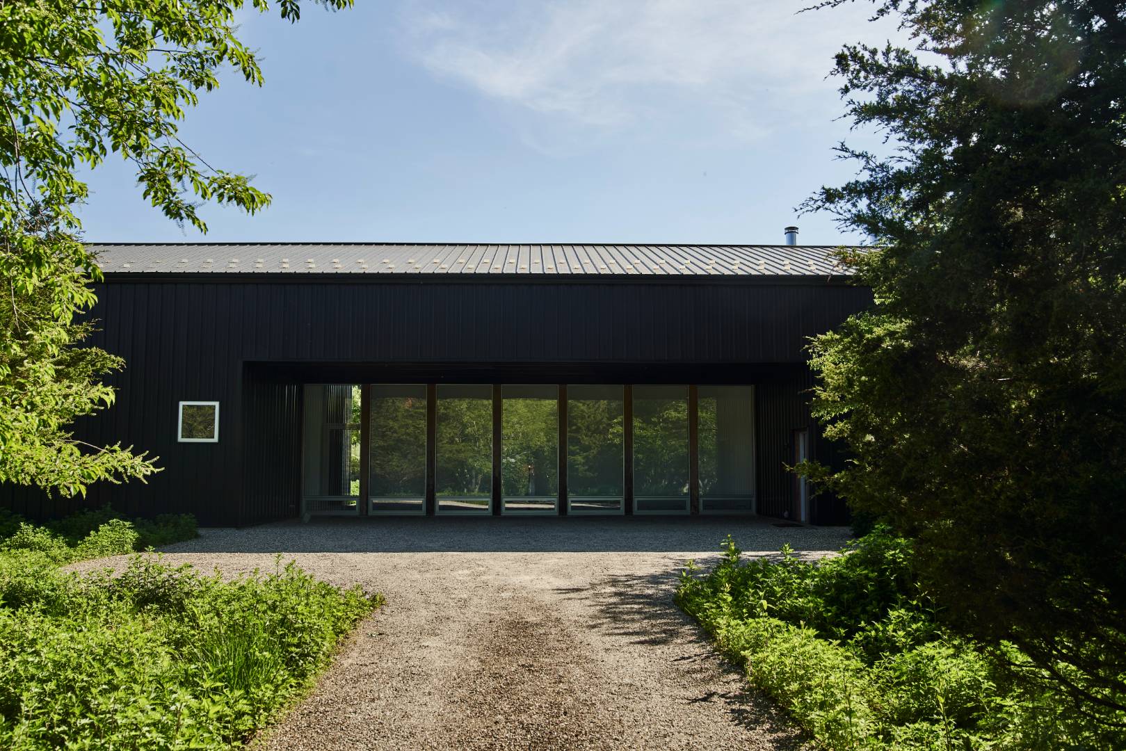 78 Windmill Lane Water Mill, NY 11976 - Photo 2 of 26 front view of a house with a yard