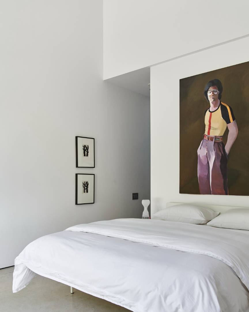 78 Windmill Lane Water Mill, NY 11976 - Photo 20 of 26 a bedroom with a bed and a painting on the wall