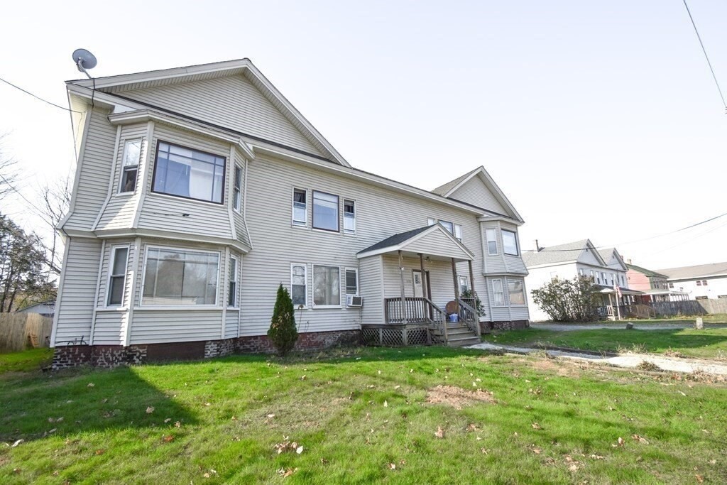 a front view of house with yard and porch