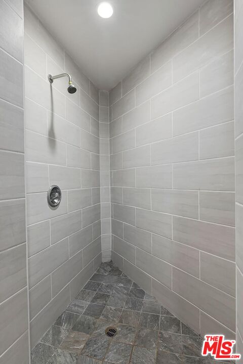 1169 Wellesley Avenue, Unit 101 Los Angeles, CA 90049 - Photo 22 of 26 a bathroom with a shower