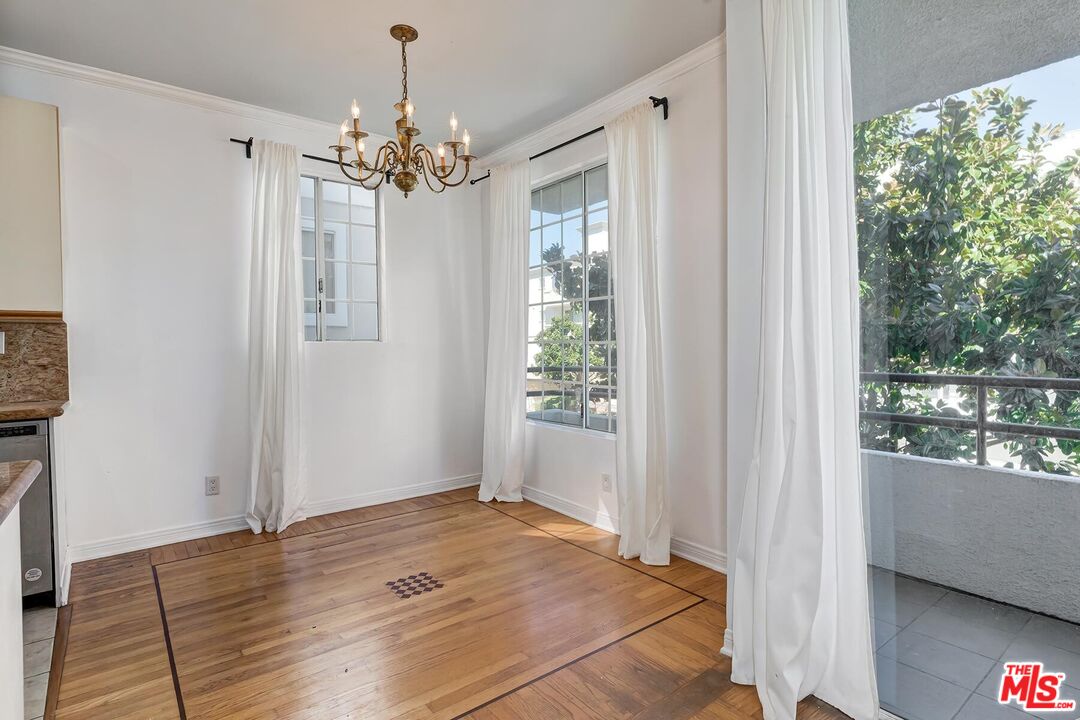 1169 Wellesley Avenue, Unit 101 Los Angeles, CA 90049 - Photo 9 of 26 a view of an empty room with a window