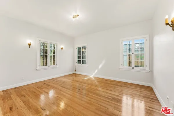 a view of an empty room with windows