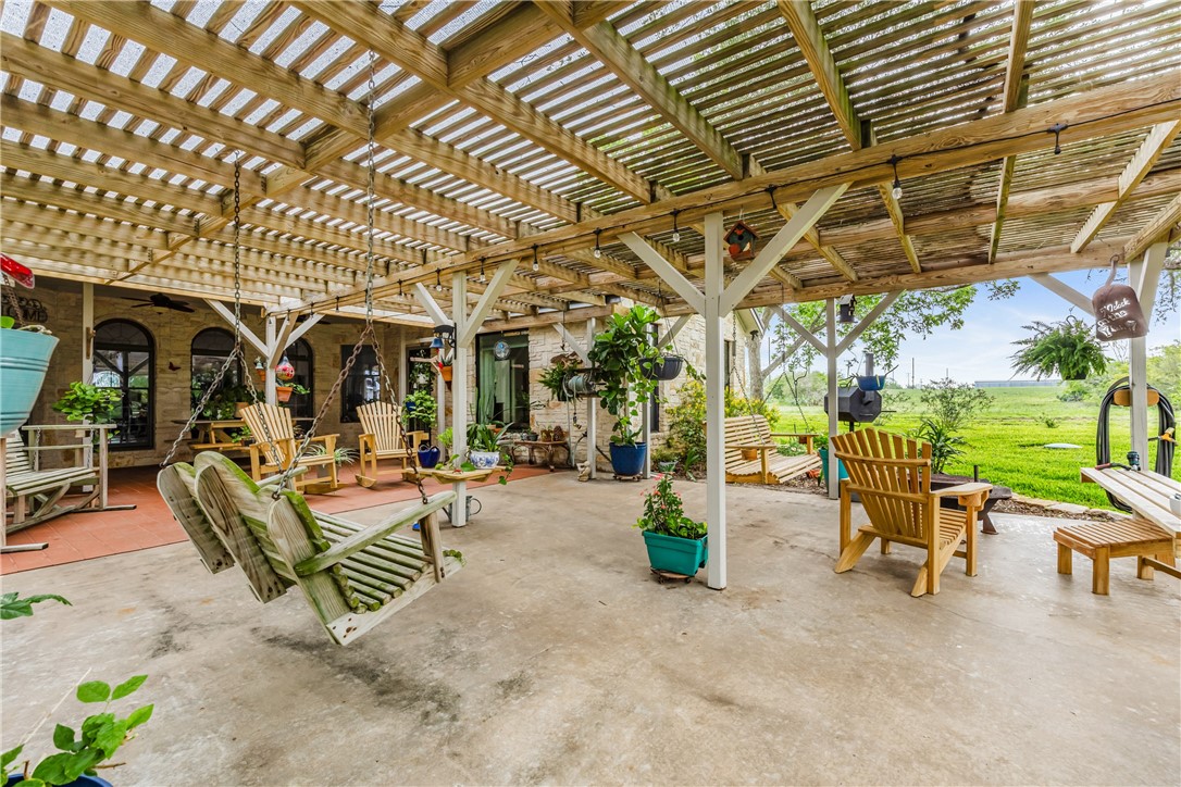 345 Trail Ridge Drive Sandia, TX 78383 - Photo 14 of 40 a view of a patio with a table and chairs and potted plants