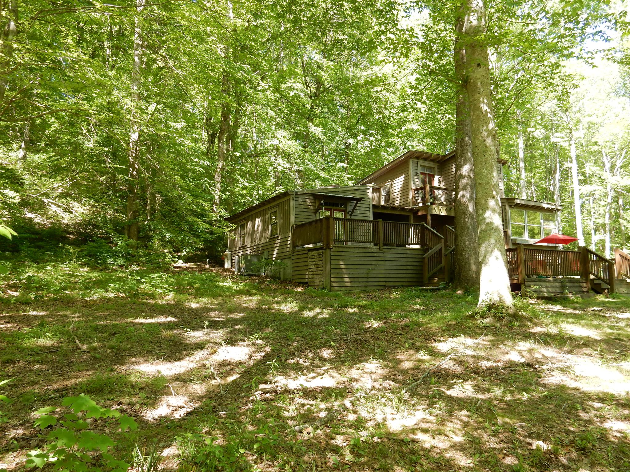 7389 Hunting Camp Road Fairview, TN 37062 - Photo 4 of 25 a yellow building in middle of forest
