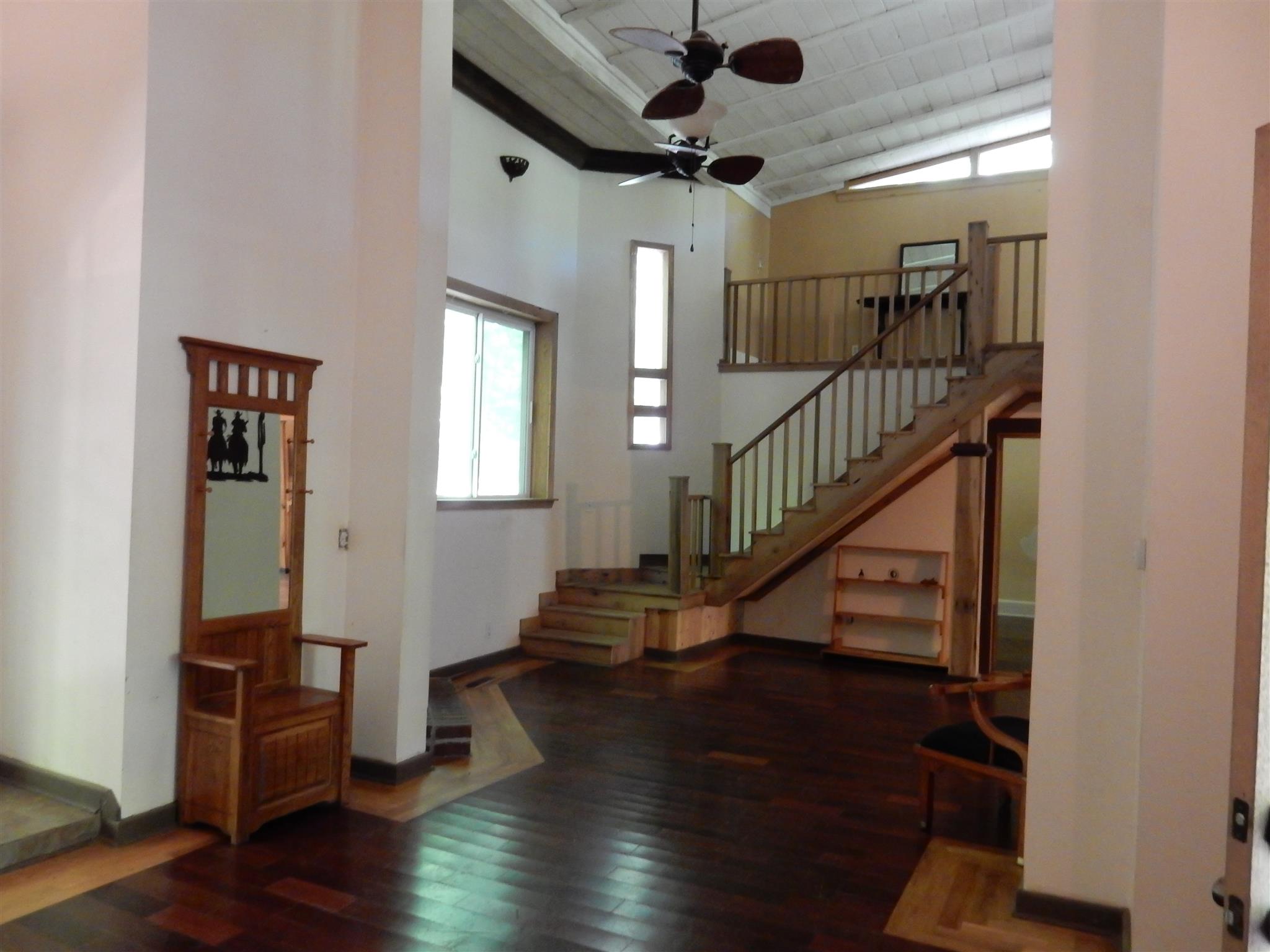 7389 Hunting Camp Road Fairview, TN 37062 - Photo 6 of 25 a view of entryway with wooden floor and stairs