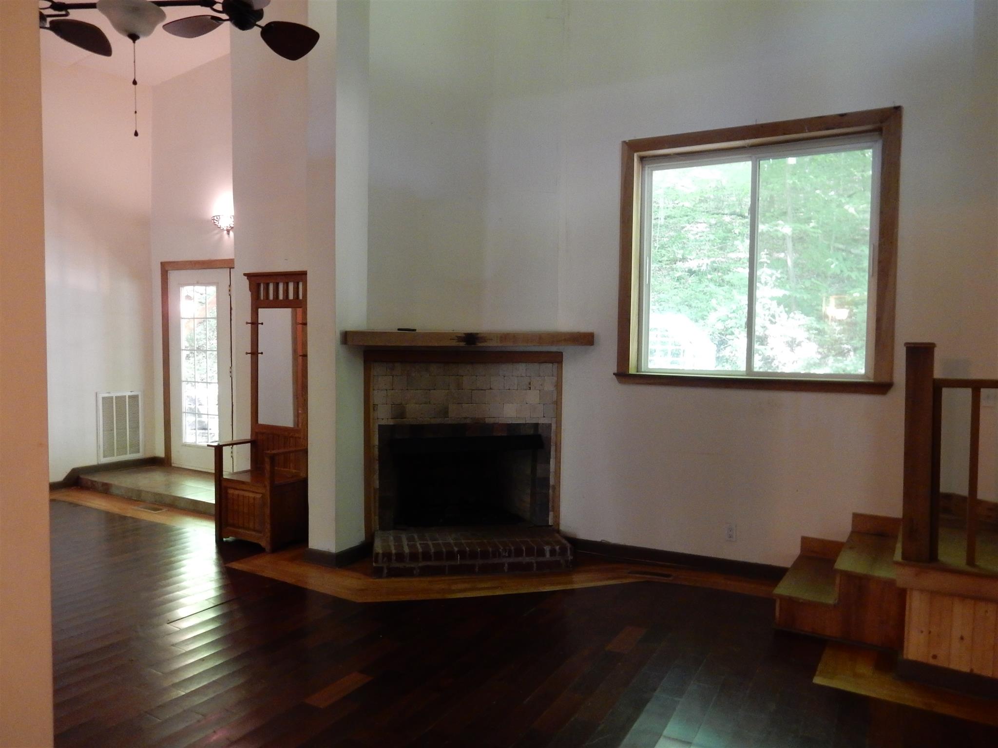 7389 Hunting Camp Road Fairview, TN 37062 - Photo 8 of 25 a living room with furniture and a fireplace