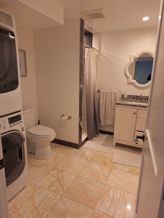 48 Gee Avenue, Unit B Gloucester, MA 01930 - Photo 3 of 12 a bathroom with a toilet mirror and tub