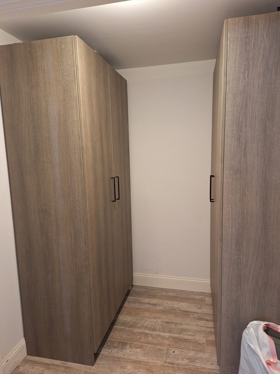 48 Gee Avenue, Unit B Gloucester, MA 01930 - Photo 5 of 12 a view of a bathroom with wooden floor