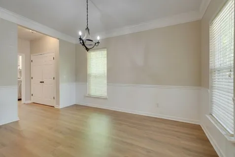 a living room with furniture a fireplace and a table