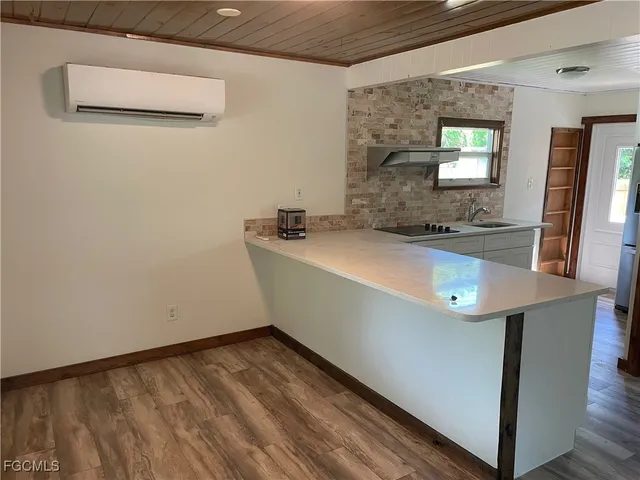 a room with a sink and a mirror