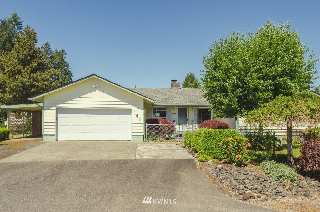 157 Galaxie Road Chehalis, WA 98532 - Photo 1 of 21 a front view of a house with a yard and garage