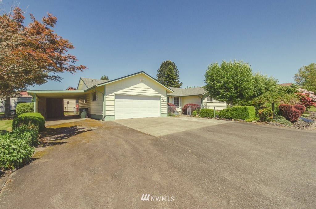 157 Galaxie Road Chehalis, WA 98532 - Photo 2 of 21 a front view of a house with a yard and garage