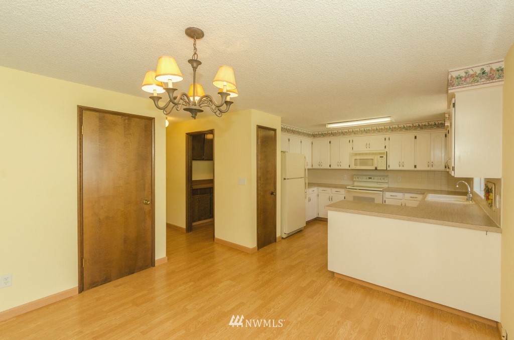 157 Galaxie Road Chehalis, WA 98532 - Photo 8 of 21 a view of a kitchen and a chandelier