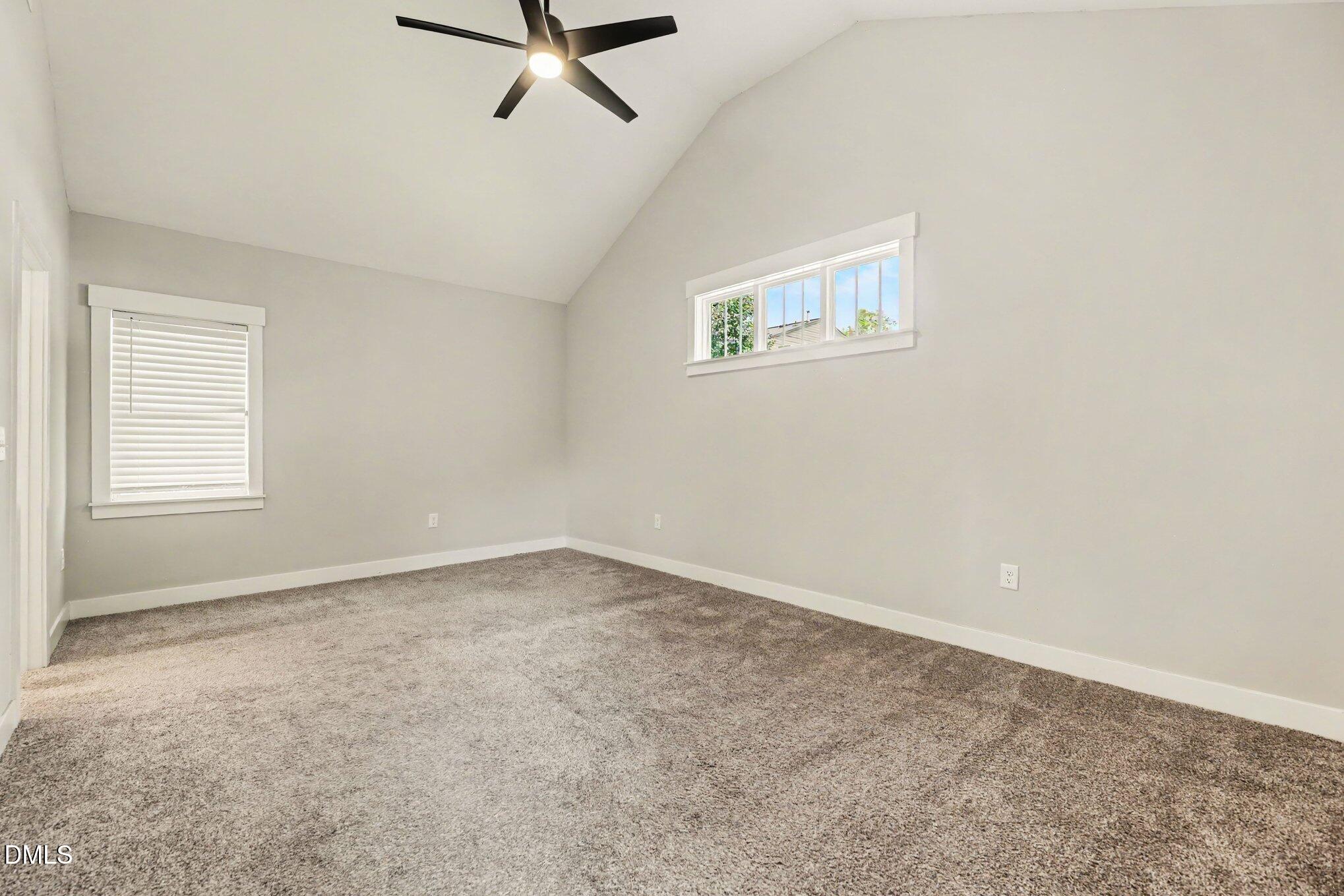 2111 Milburnie Road Raleigh, NC 27610 - Photo 12 of 27 Owners bedroom with high ceiling, ceiling fan, walk in closet and private bath