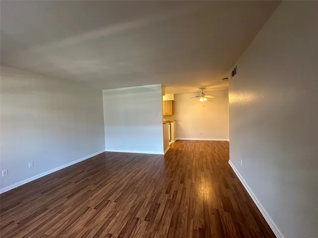 a view of gallery with wooden floor