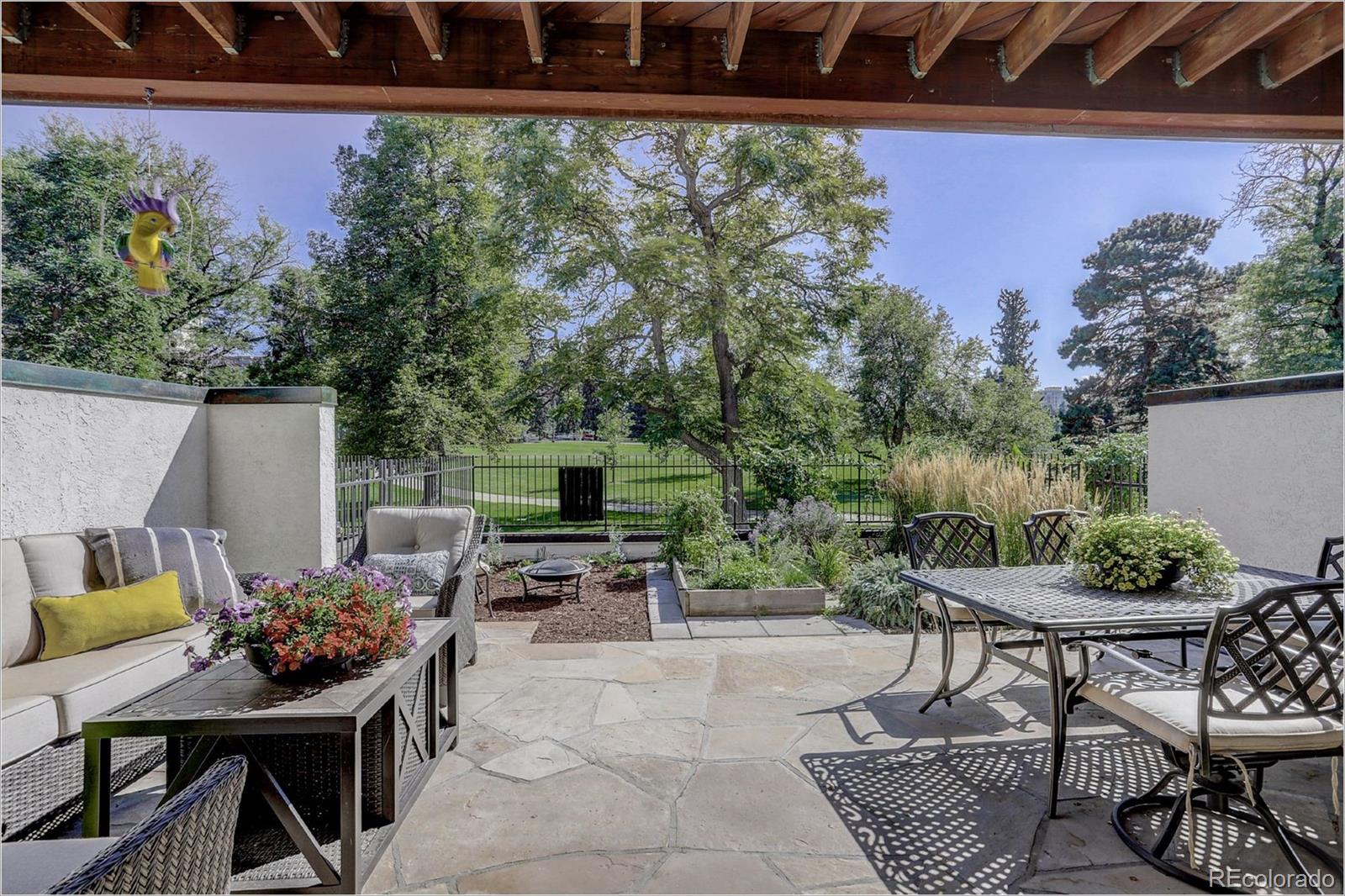 1291 High Street, Unit F Denver, CO 80218 - Photo 12 of 35 a backyard of a house with table and chairs
