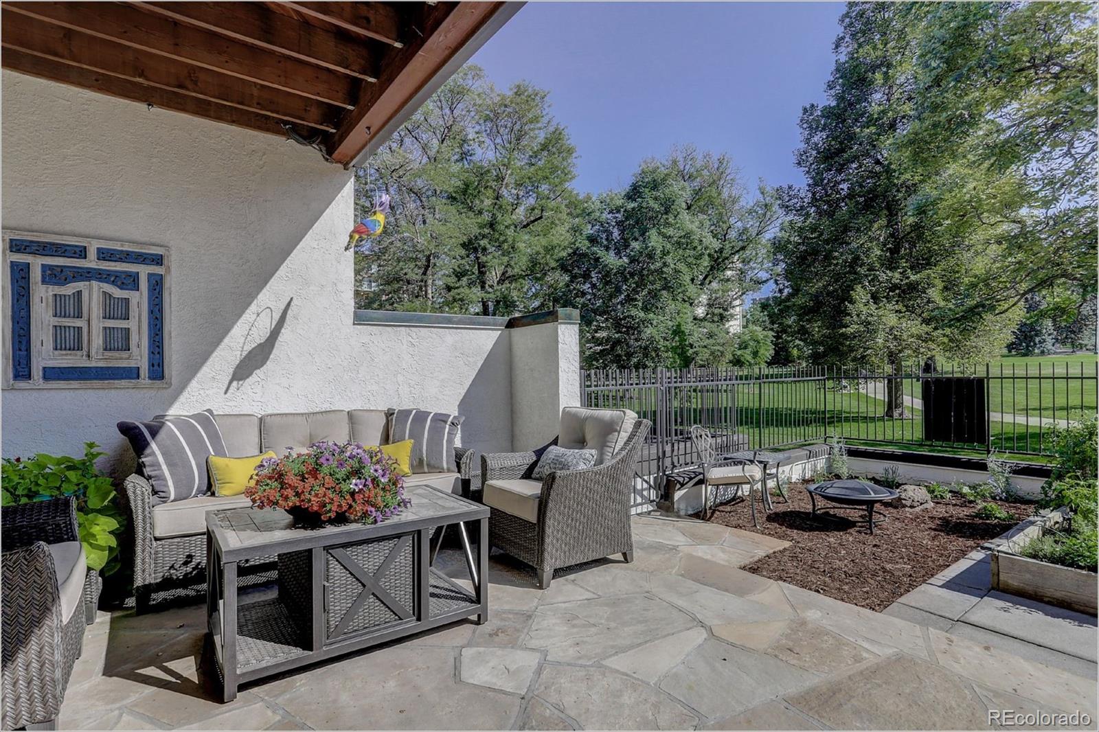 1291 High Street, Unit F Denver, CO 80218 - Photo 13 of 35 a view of a patio with couches and a fire pit and a yard