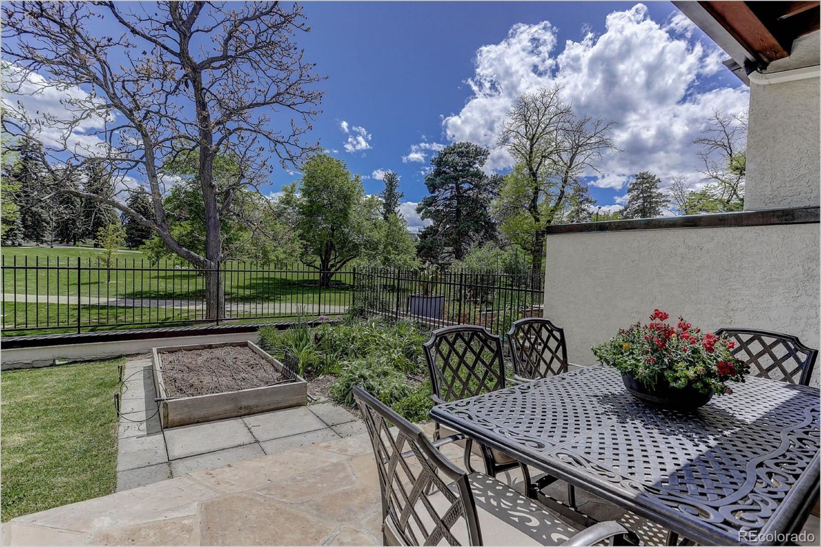 1291 High Street, Unit F Denver, CO 80218 - Photo 2 of 35 a view of backyard with seating and green space