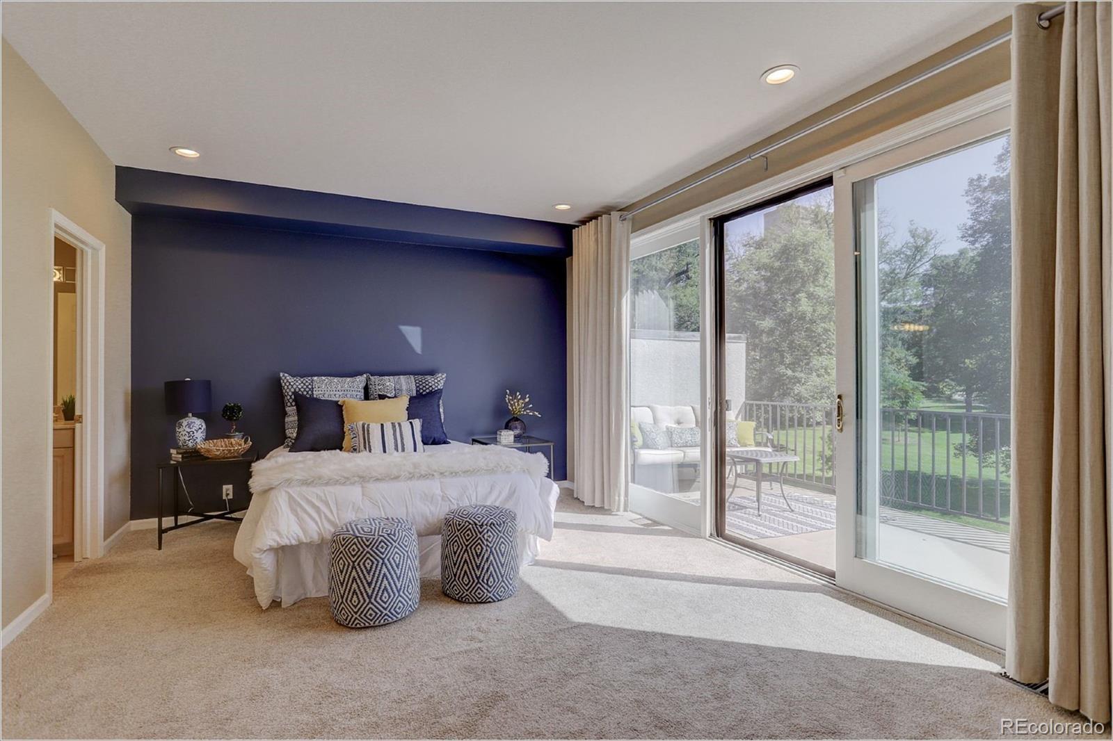 1291 High Street, Unit F Denver, CO 80218 - Photo 21 of 35 a bedroom with a bed and large window