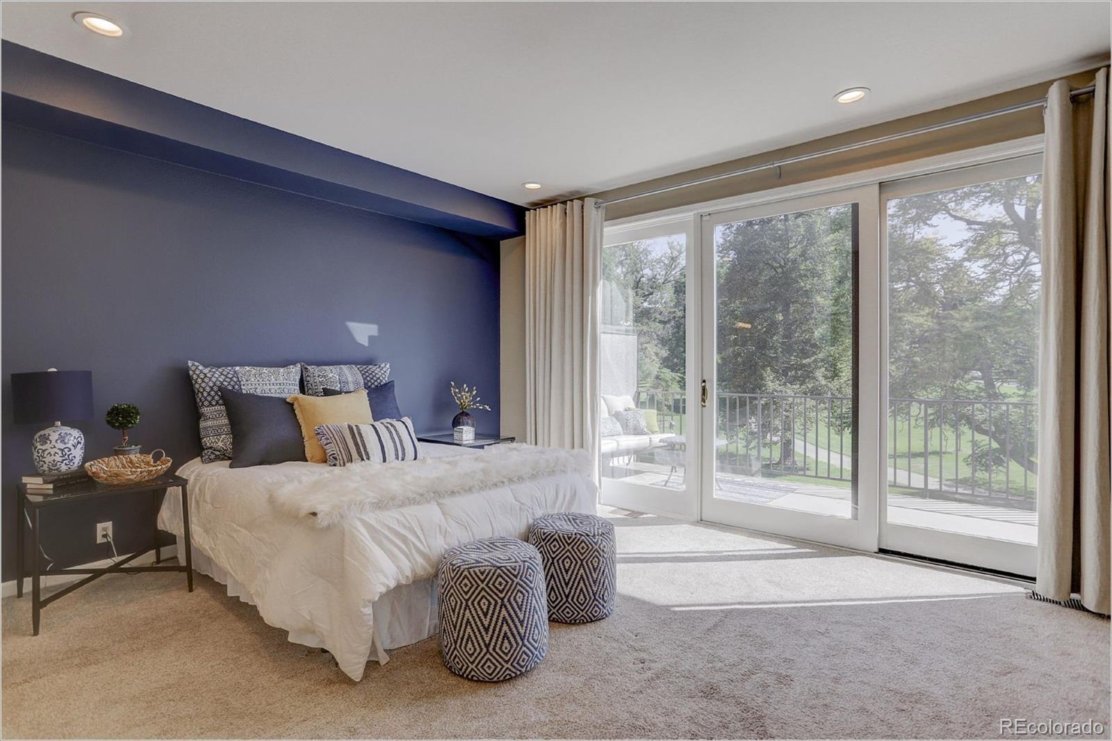 1291 High Street, Unit F Denver, CO 80218 - Photo 22 of 35 a bedroom with a bed and large window
