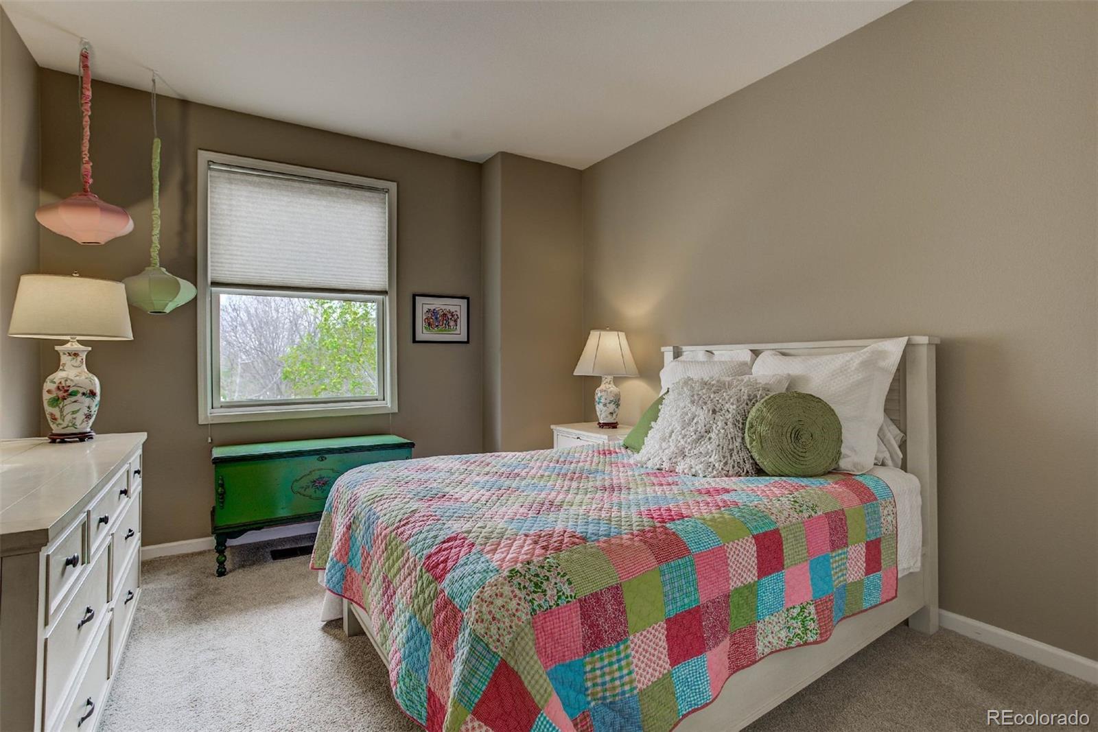 1291 High Street, Unit F Denver, CO 80218 - Photo 27 of 35 a bedroom with a bed and a lamp on dresser next to a window
