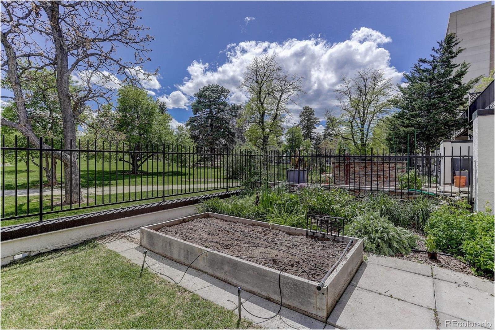 1291 High Street, Unit F Denver, CO 80218 - Photo 3 of 35 a view of a backyard with a small park