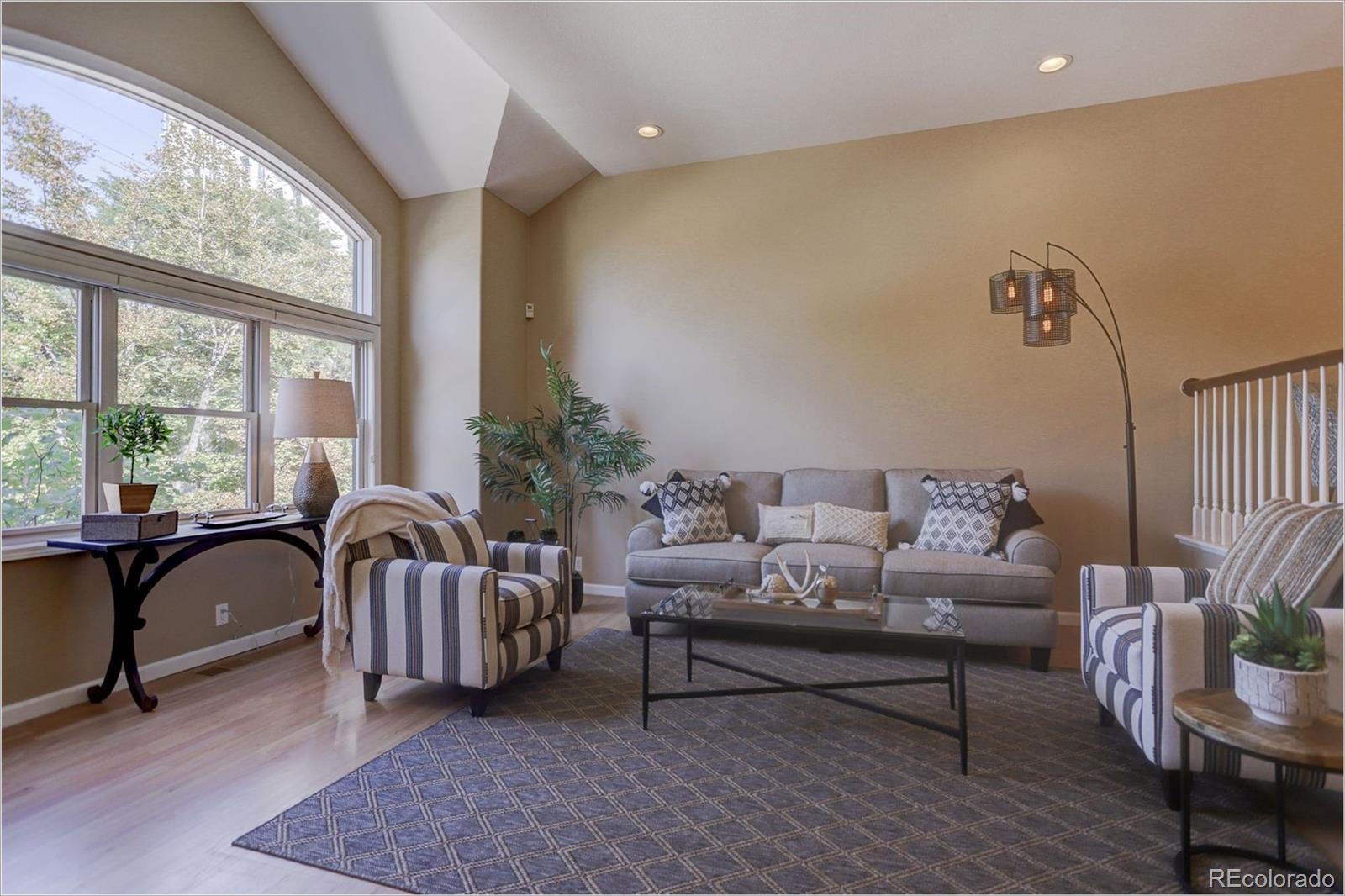 1291 High Street, Unit F Denver, CO 80218 - Photo 6 of 35 a living room with furniture and windows