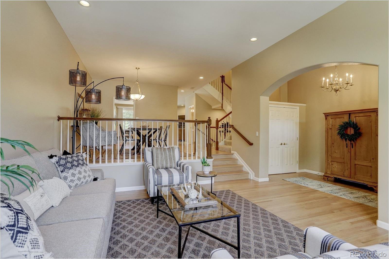 1291 High Street, Unit F Denver, CO 80218 - Photo 7 of 35 a living room with stairs and furniture