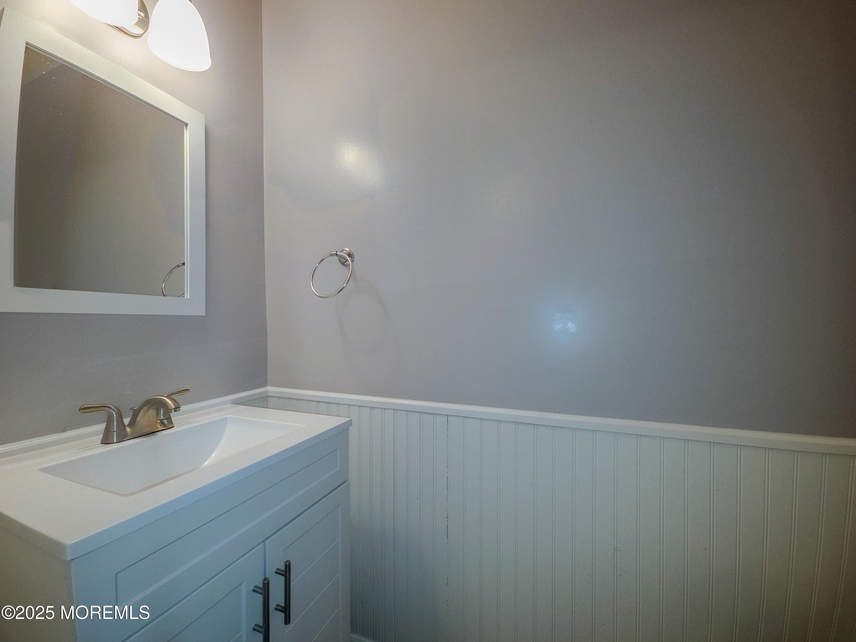 12 Creek Road Brick, NJ 08724 - Photo 4 of 7 a bathroom with a sink and a mirror