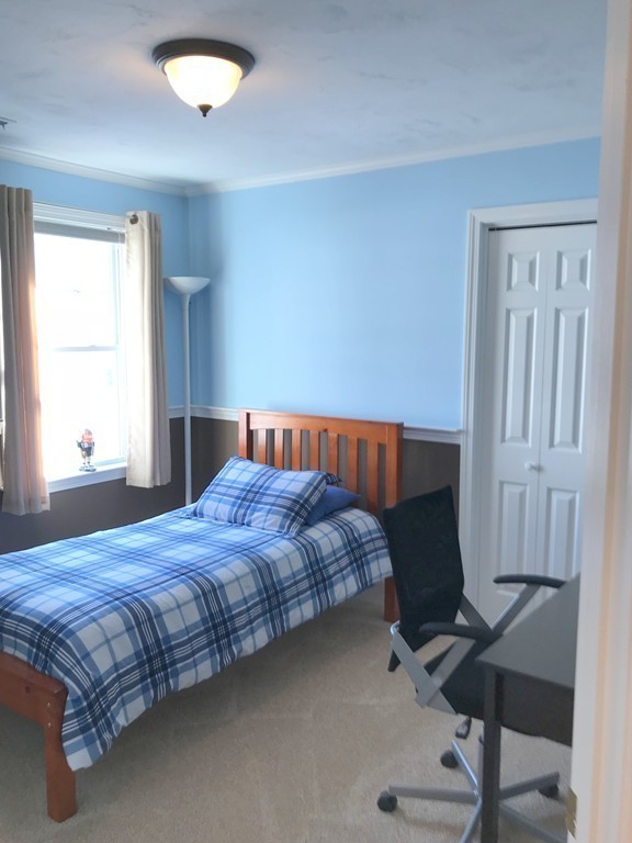343 Quarry Street, Unit 2 Quincy, MA 02169 - Photo 14 of 30 a bedroom with a bed and a window