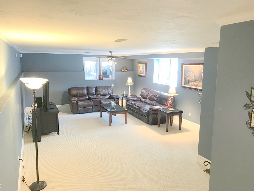 343 Quarry Street, Unit 2 Quincy, MA 02169 - Photo 23 of 30 a living room with furniture and a table