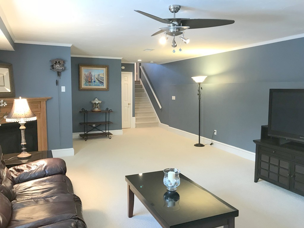 343 Quarry Street, Unit 2 Quincy, MA 02169 - Photo 24 of 30 a living room with furniture and a flat screen tv