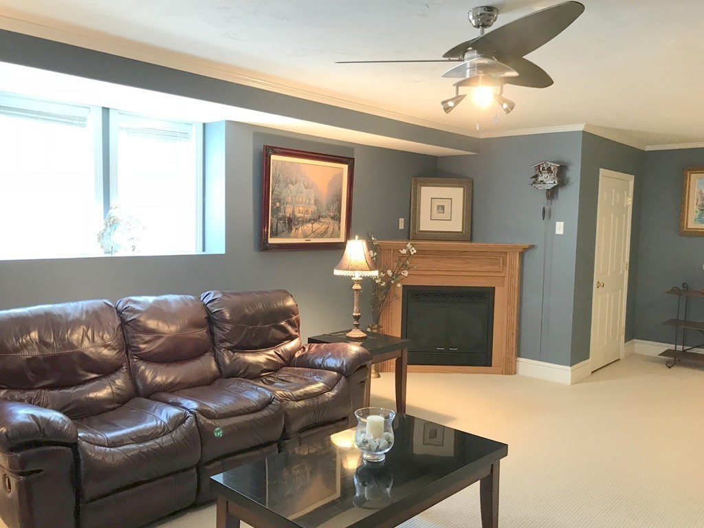 343 Quarry Street, Unit 2 Quincy, MA 02169 - Photo 26 of 30 a living room with furniture a fireplace and a window