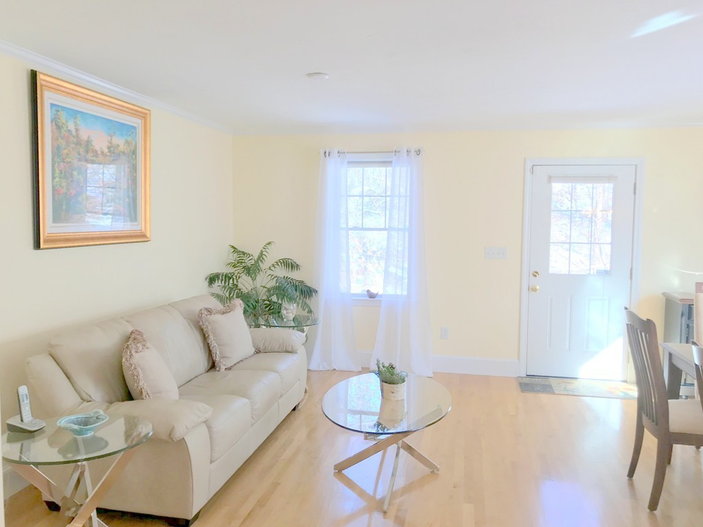 343 Quarry Street, Unit 2 Quincy, MA 02169 - Photo 7 of 30 a living room with furniture and wooden floor