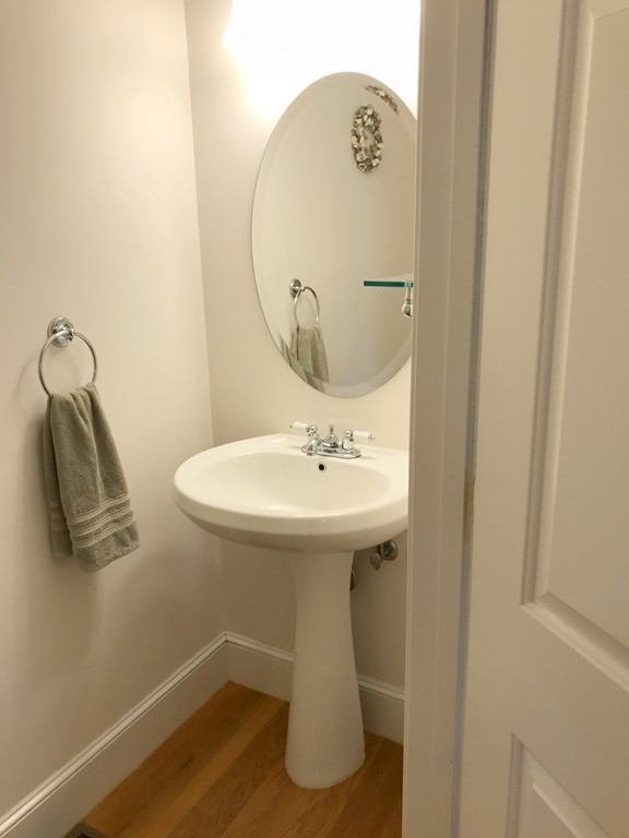 343 Quarry Street, Unit 2 Quincy, MA 02169 - Photo 8 of 30 a bathroom with a sink and a mirror