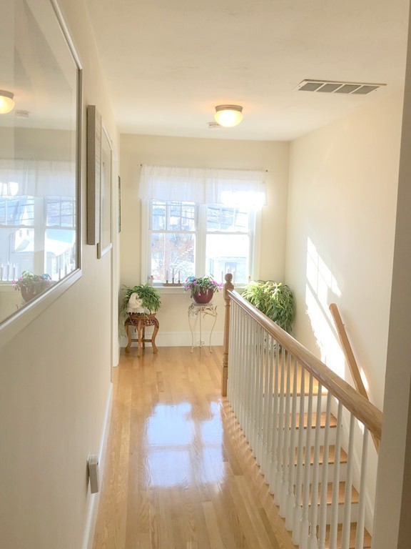 343 Quarry Street, Unit 2 Quincy, MA 02169 - Photo 10 of 30 a view of a room with wooden floor and furniture