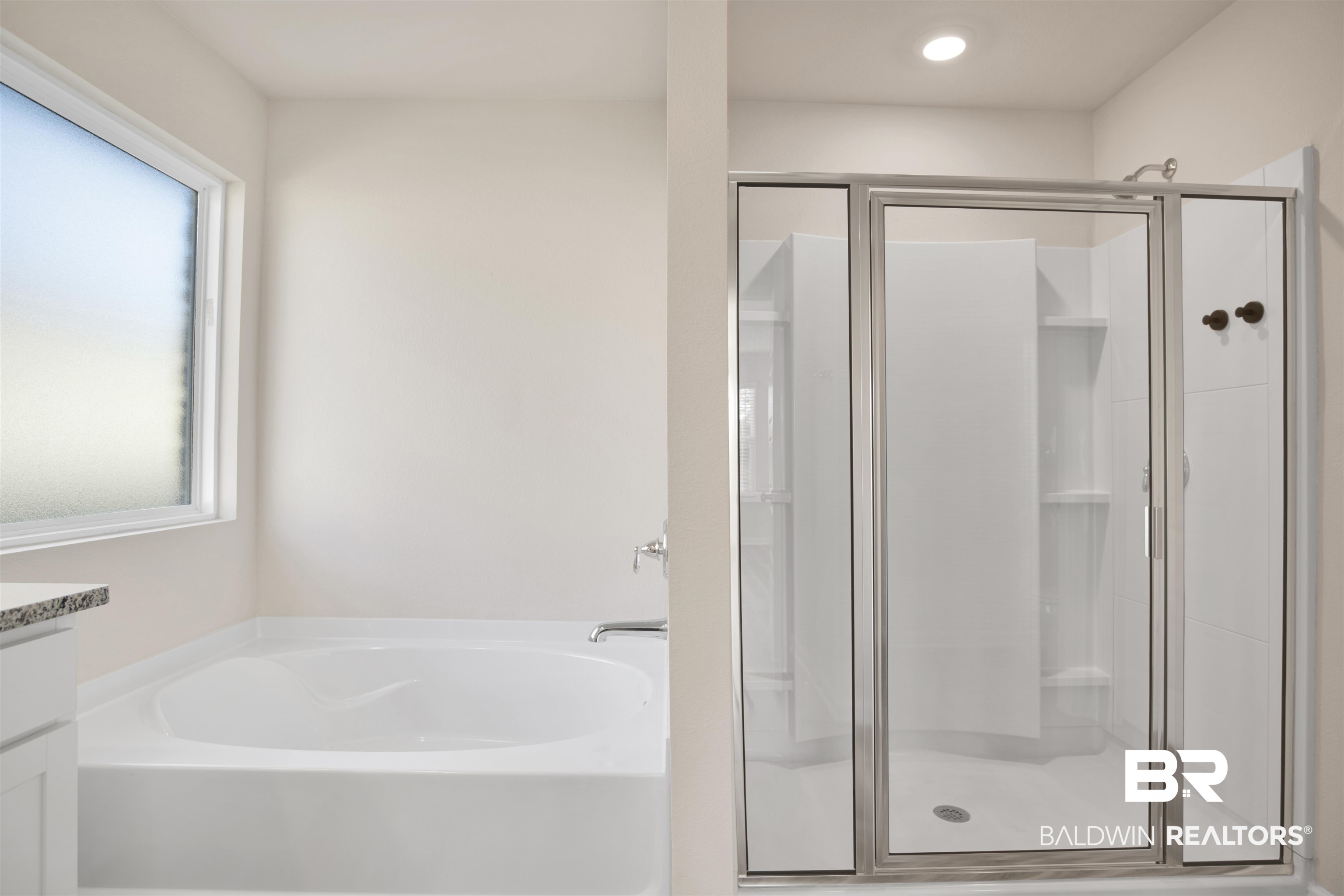 32038 Lyon Road Daphne, AL 36527 - Photo 18 of 30 Bathroom with a bath, a stall shower, and vanity