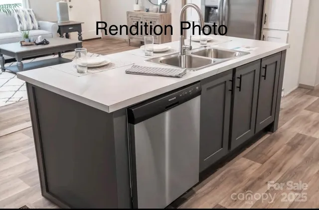 a kitchen with a sink and a refrigerator