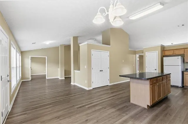 a view of a kitchen cabinets and wooden floor