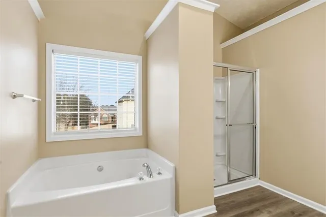 a white bath tub sitting next to a window