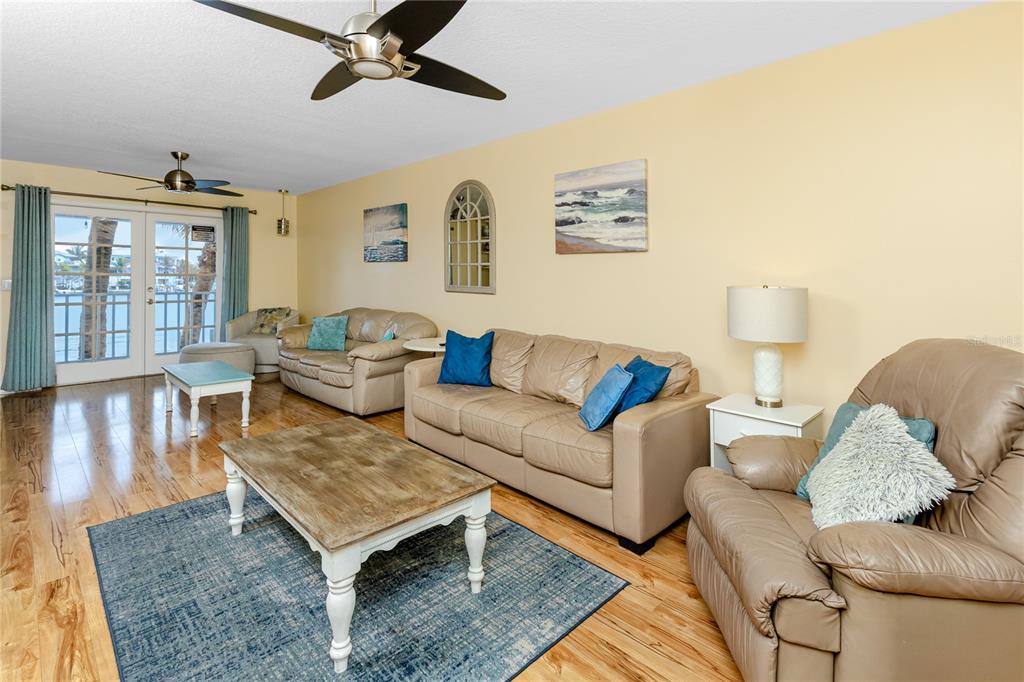 2601 Bay Boulevard Indian Rocks Beach, FL 33785 - Photo 11 of 64 a living room with furniture and wooden floor