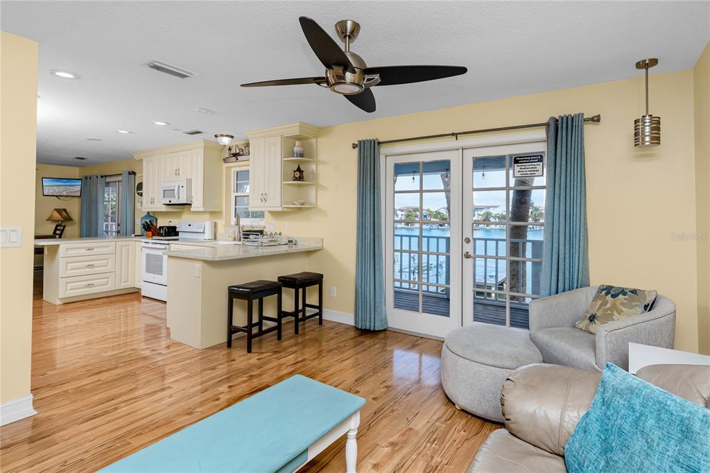 2601 Bay Boulevard Indian Rocks Beach, FL 33785 - Photo 12 of 64 a living room with furniture and a large window