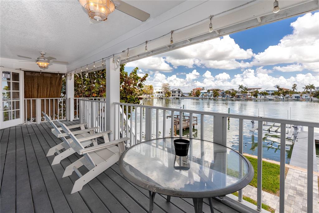 2601 Bay Boulevard Indian Rocks Beach, FL 33785 - Photo 17 of 64 a view of a balcony with lake view and wooden floor