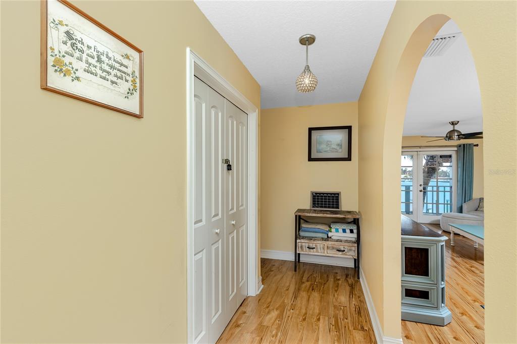 2601 Bay Boulevard Indian Rocks Beach, FL 33785 - Photo 18 of 64 a view of a hallway view with wooden floor and staircase