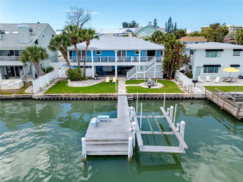 2601 Bay Boulevard Indian Rocks Beach, FL 33785 - Photo 2 of 64 a view of house with swimming pool outdoor seating and lake view